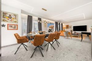 a living room with a dining room table and chairs at Villa Marko Forever in Makarska