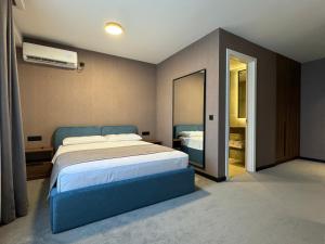 Ένα ή περισσότερα κρεβάτια σε δωμάτιο στο Five Apartments