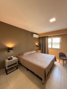 Postel nebo postele na pokoji v ubytování Hotel Alvarado Suites