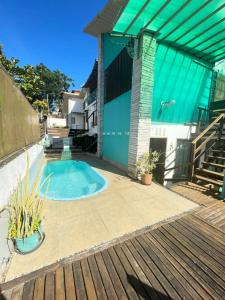 Swimmingpoolen hos eller tæt på Ape Familia c Ar e prox Praias e Centro Búzios 4p
