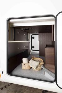 a view of the inside of a rv with baskets at Lodge Camper am Rursee Deine Eifel Auszeit in Simmerath
