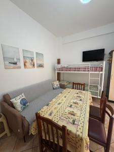 a bedroom with a bed and a couch and a bunk bed at Mira Orikum in Orikum