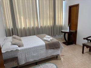 Posteľ alebo postele v izbe v ubytovaní Apartamento 102 espaçoso e tranquilo