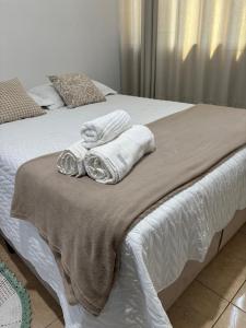 Posteľ alebo postele v izbe v ubytovaní Apartamento 102 espaçoso e tranquilo