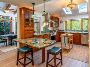a kitchen with a large island with a counter top at Tropical Retreat North by Paradise Retreats in Santa Barbara