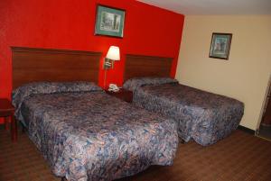 Letto o letti in una camera di Mount Laurel Motel