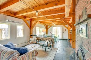 a living room with a couch and a table at Cozy Pet-Friendly Cottage Near Fort Knox and Acadia in Penobscot