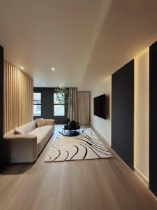 a living room with a couch and a rug at 3 KING beds Free Parking Modern Luxe Escape in Pittsburgh