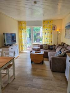 Khu vực ghế ngồi tại Ferienhaus am Kurpark Norddeich