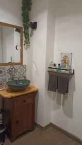 a bathroom with a sink and a mirror at La Tourelle - Gite et chambre d'hôte in Saint-Antonin +24 photos