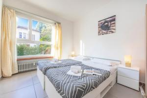 Ένα ή περισσότερα κρεβάτια σε δωμάτιο στο City Apartment - Happy Rentals