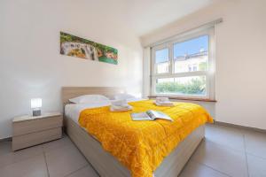 Ένα ή περισσότερα κρεβάτια σε δωμάτιο στο City Apartment - Happy Rentals