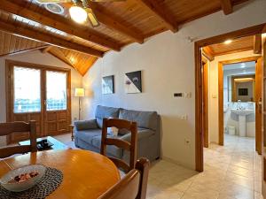a living room with a couch and a table at Apartamentos Lausan in Gavín