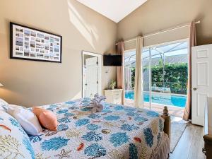 a bedroom with a bed and a swimming pool at Spacious 4br Villa W Spa & Resort Access in Orlando +71 photos