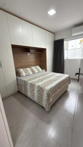 Giường trong phòng chung tại casa com suite e banheiro social +7 ảnh