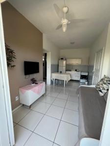 a living room with a couch and a flat screen tv at Los Hermanos Residencial in Florianópolis +82 photos