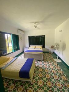 Giường trong phòng chung tại Varadero Casa de Playa in Coveñas +23 ảnh