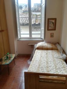 Ένα ή περισσότερα κρεβάτια σε δωμάτιο στο Casa Morgana