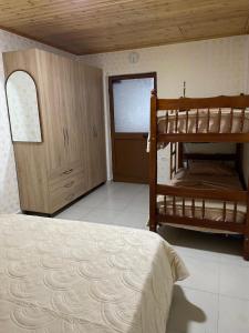 a bedroom with two bunk beds and a window at Aldo House in Prekal