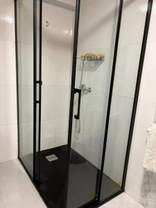 a shower with a glass door in a bathroom at casa en Cedeira in Cedeira