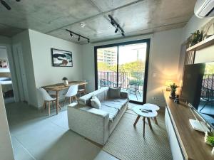 a living room with a couch and a table at First del Sol in Asuncion