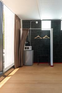 a room with a kitchen with a table and a window at Hotel WW in Mérida +15 photos