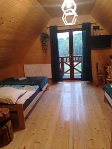 Postel nebo postele na pokoji v ubytování Domek w dolinie ciszy Pieniny