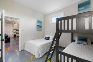 a bedroom with a bunk bed and a ladder at Pleasant Valley Resort in Arcadia