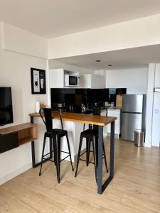 Kuchyň nebo kuchyňský kout v ubytování MarDelSuites - Studio Estándar Piso 12 a Pasos del Mar, Amenities, Seguridad 24hrs, Cochera Opcional