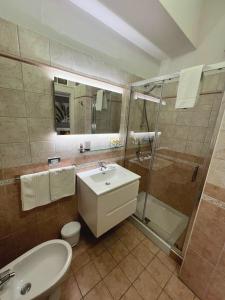 a bathroom with a sink toilet and a shower at CASA DEL SOLE Accomodation in Tropea +57 photos