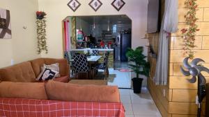 a living room with a couch and a table at Familiar in Ananindeua
