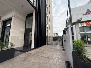 a entrance to a building with a gate in front at Bluewaters, Labone in Accra +41 photos