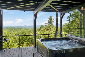a hot tub on a deck with a view at Top of the Mountain Breathtaking Views Hot Tub in Blue Ridge