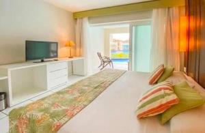 Postel nebo postele na pokoji v ubytování Suíte aconchegante vista jardim