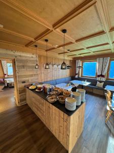 a kitchen with a counter with food on it at Chalet Frapes in San Martino in Badia