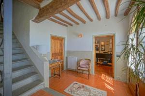 a room with stairs and a desk and a chair at Il Poggio al Sole in Fiesole