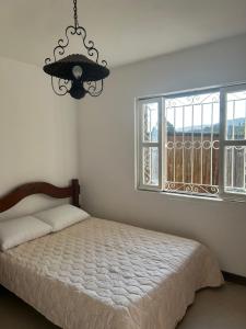 Ένα ή περισσότερα κρεβάτια σε δωμάτιο στο Refúgio Serrano +30 φωτογραφίες