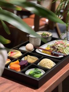 a tray filled with different types of food on a table at Miss or Dismiss in Chongqing