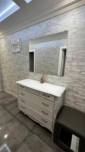 a bathroom with a sink and a mirror at APARTMENT PREMIUM VIP in Berdychiv +82 photos