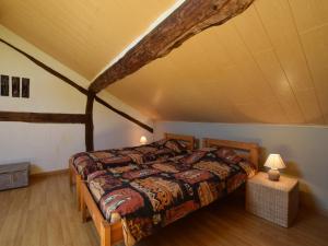 a bedroom with a bed in a attic at Gouvy Forest Farmhouse in Gouvy +32 photos