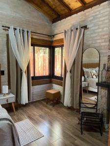 Postel nebo postele na pokoji v ubytování Chalé Encantos da Serra