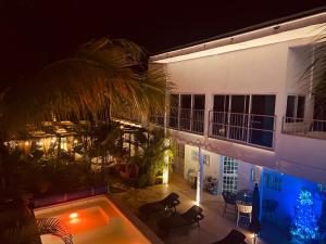 a house with a swimming pool at night at Casa Arena in Lo de Marcos
