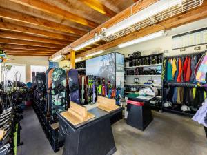 a ski shop with a lot of skis on display at Hotel Alpen Blick in Myoko