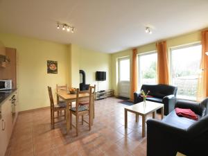 a kitchen and living room with a table and chairs at Ferienhaus in Zierow in Zierow