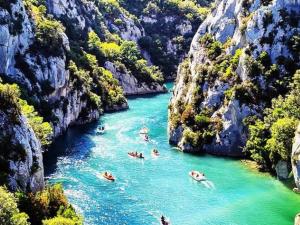 a group of people swimming in a river in a canyon at Mobil-home à Esparron-de-Verdon - 2 chambres, terrasse - API-1-52-578 in Esparron-de-Verdon