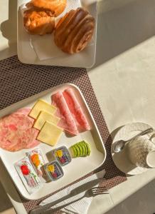 a tray of food with different types of food on a table at Andari Hoteles in Arequipa