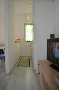 TV a/nebo společenská místnost v ubytování Casa Miki