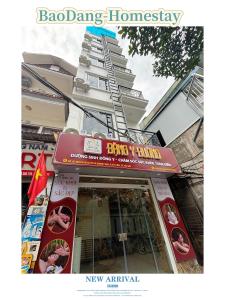 a building with a sign on the front of a restaurant at Baodang-Homestay in Hanoi