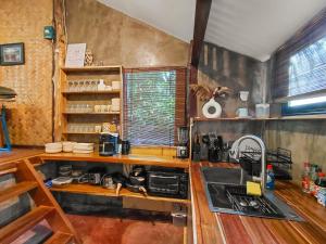 a kitchen with a sink and a counter top at La Casita in El Nido