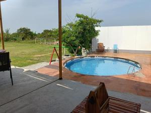 a swimming pool in the middle of a yard at Asia Casa in Asia